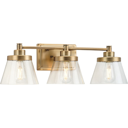 Product image for Progress P300350-163 Hinton Collection Three-Light Vintage Brass Clear Seeded Glass Farmhouse Bath Vanity Light