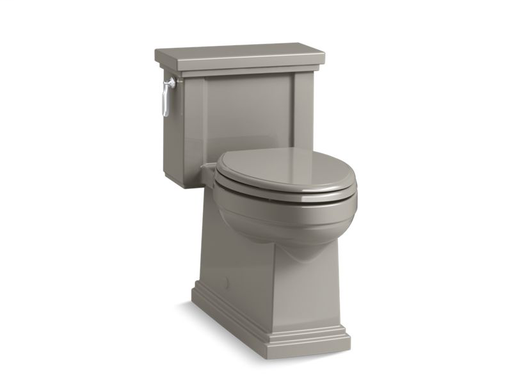 Tresham® Comfort Height® one-piece compact elongated 1.28 gpf toilet with AquaPiston® flush technology, left-hand trip lever and skirted trapway, Cashmere