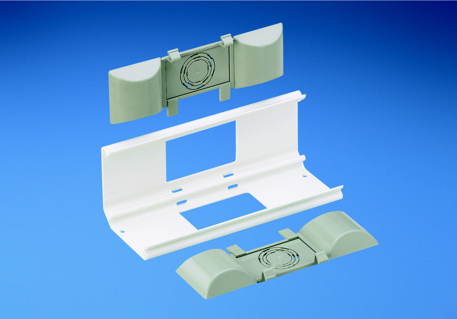 Product image for Panduit WCM35BFIW Backfeed fitting. Inserts allow cable entry and exit through the back of the raceway and conduit. Breakouts include 1/2", 3/4", and 1" .