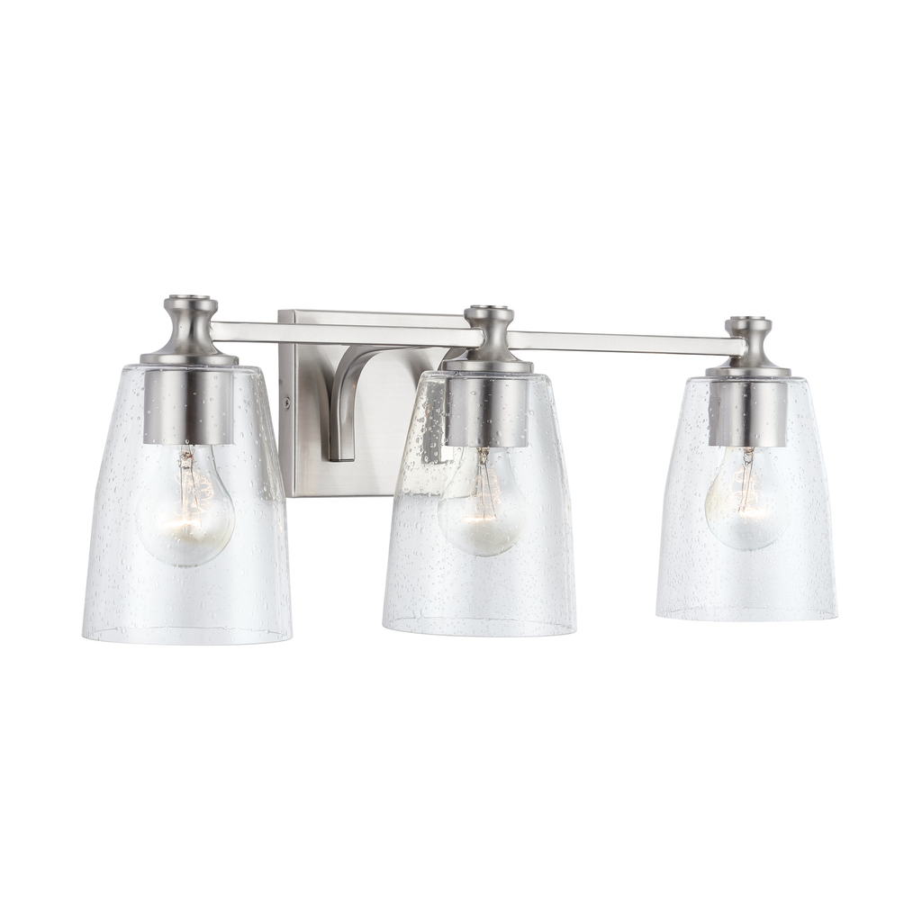 23" W x 8.5" H x 8" E 3-Light Clear Seeded Glass Vanity in Brushed Nickel