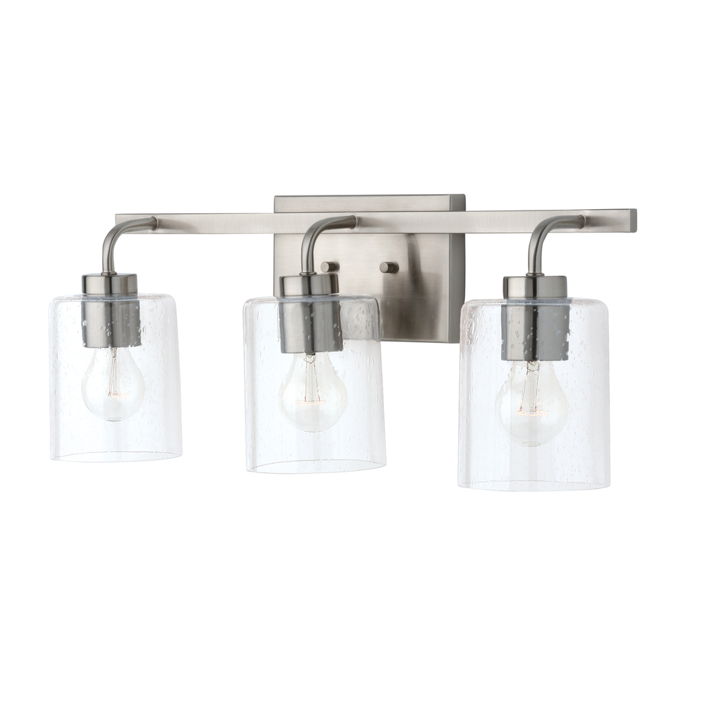 24.5" W x 9" H x 6" E 3-Light Clear Seeded Glass Vanity in Brushed Nickel