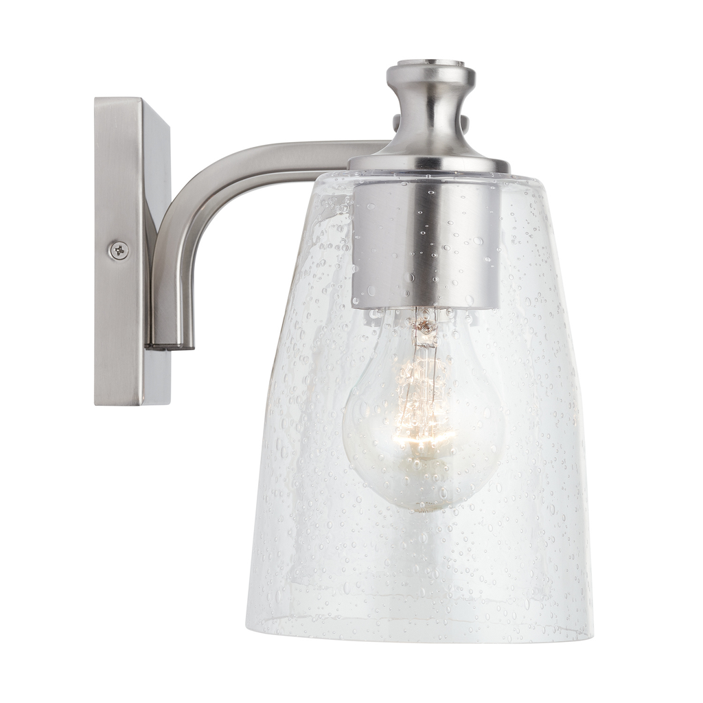 23" W x 8.5" H x 8" E 3-Light Clear Seeded Glass Vanity in Brushed Nickel